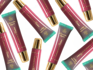 A rich deep pink lipgloss with cool undertones in a squeeze tube with a gold cap