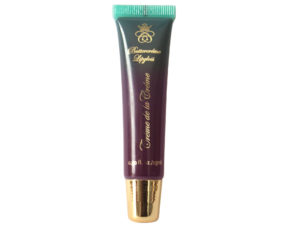 deep plum lip gloss in squeeze tube with gold cap on white background