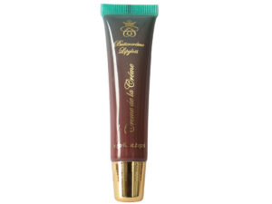 dark brown lip gloss in squeeze tube with gold cap on white background