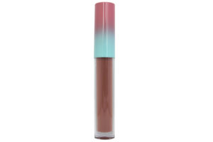 nude brown matte liquid lipstick in clear tube with pink and blue cap on white background