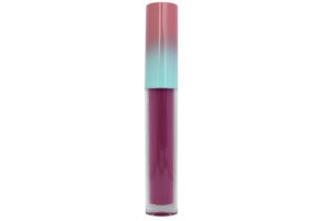 berry pink matte liquid lipstick in clear tube with pink and blue cap on white background