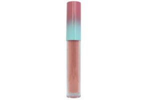 pink nude matte liquid lipstick in clear tube with pink and blue cap on white background