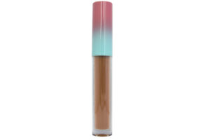 brown matte liquid lipstick in clear tube with pink and blue cap on white background