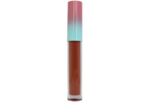 brick red matte liquid lipstick in clear tube with pink and blue cap on white background
