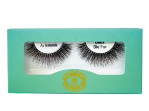 strip eyelashes in white lash tray inside teal box on white background