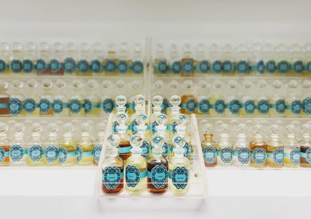 the art of custom perfumery, glass apothecary bottles filled with perfume ingredients