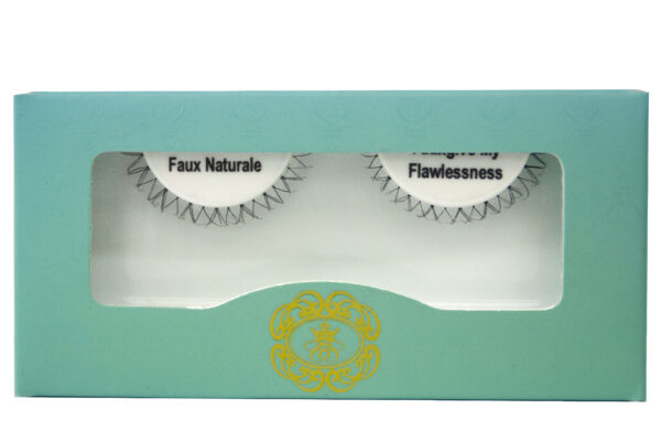 Strip eyelashes in white lash tray inside teal box on white background