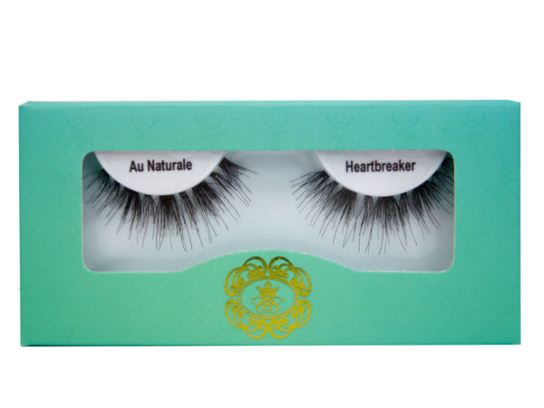 strip eyelashes in white lash tray inside teal box on white background