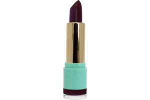 deep plum lipstick with gold case in blue container on white background