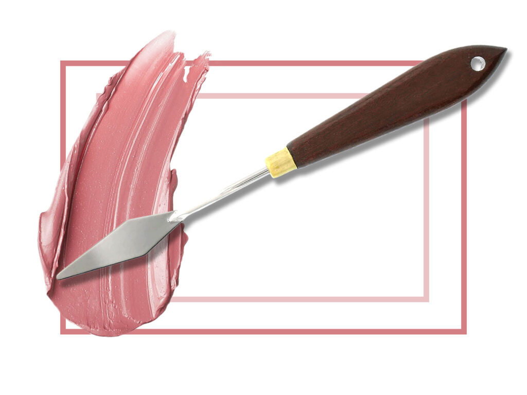 Gifts, a palette knife with a wooden handle smearing a custom blended lipstick