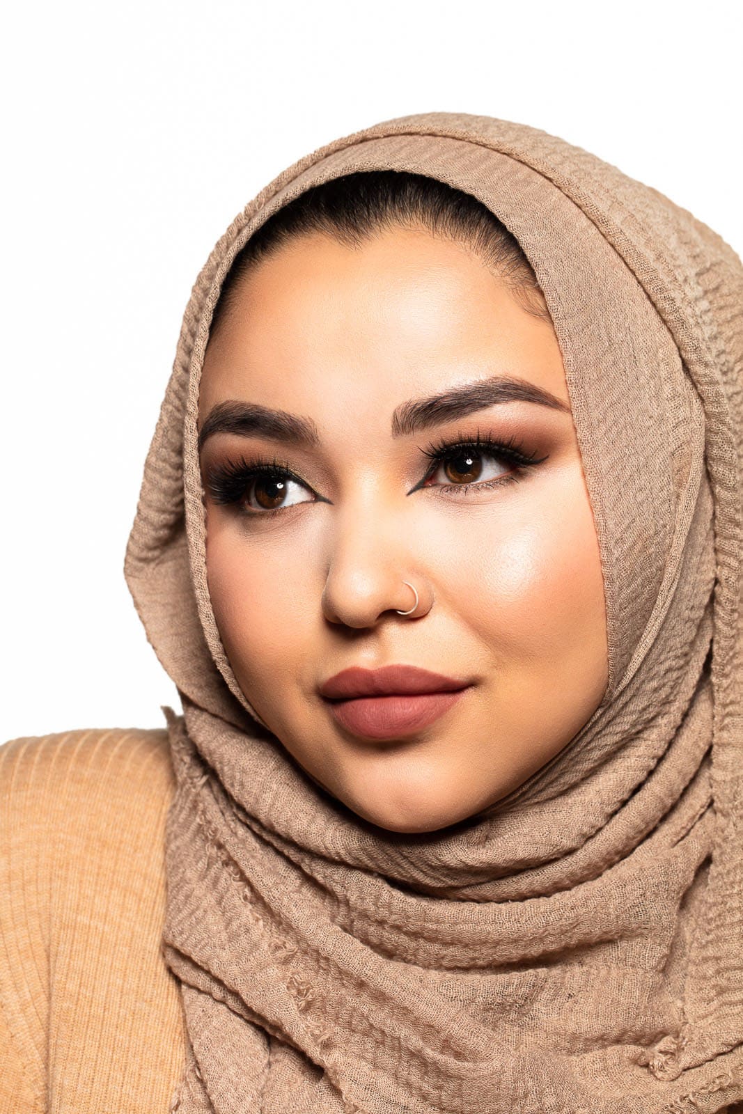 False lashes, portrait of beautiful middle eastern woman with hijab, false lashes and soft glam makeup