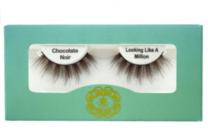 Brown strip eyelashes in white lash tray inside teal box on white background