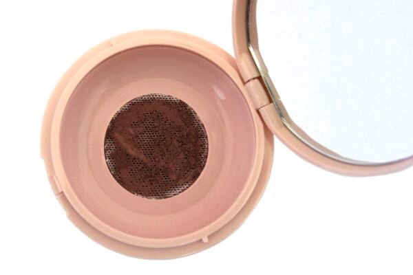 loose makeup powder in translucent plastic jar with pink flap cap lid.