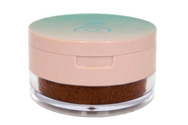 Baked Goods Baking & Setting Poudre loose makeup powder in translucent plastic jar with pink flap cap lid on white isolated background