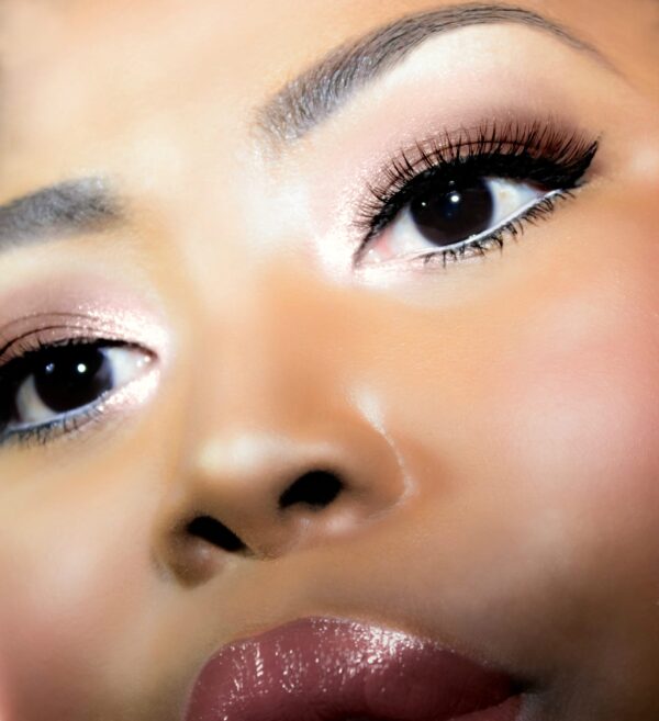 Chocolate Noir Eyelash Collection, macro shot portrait of beautiful woman wearing strip lashes and soft glam makeup