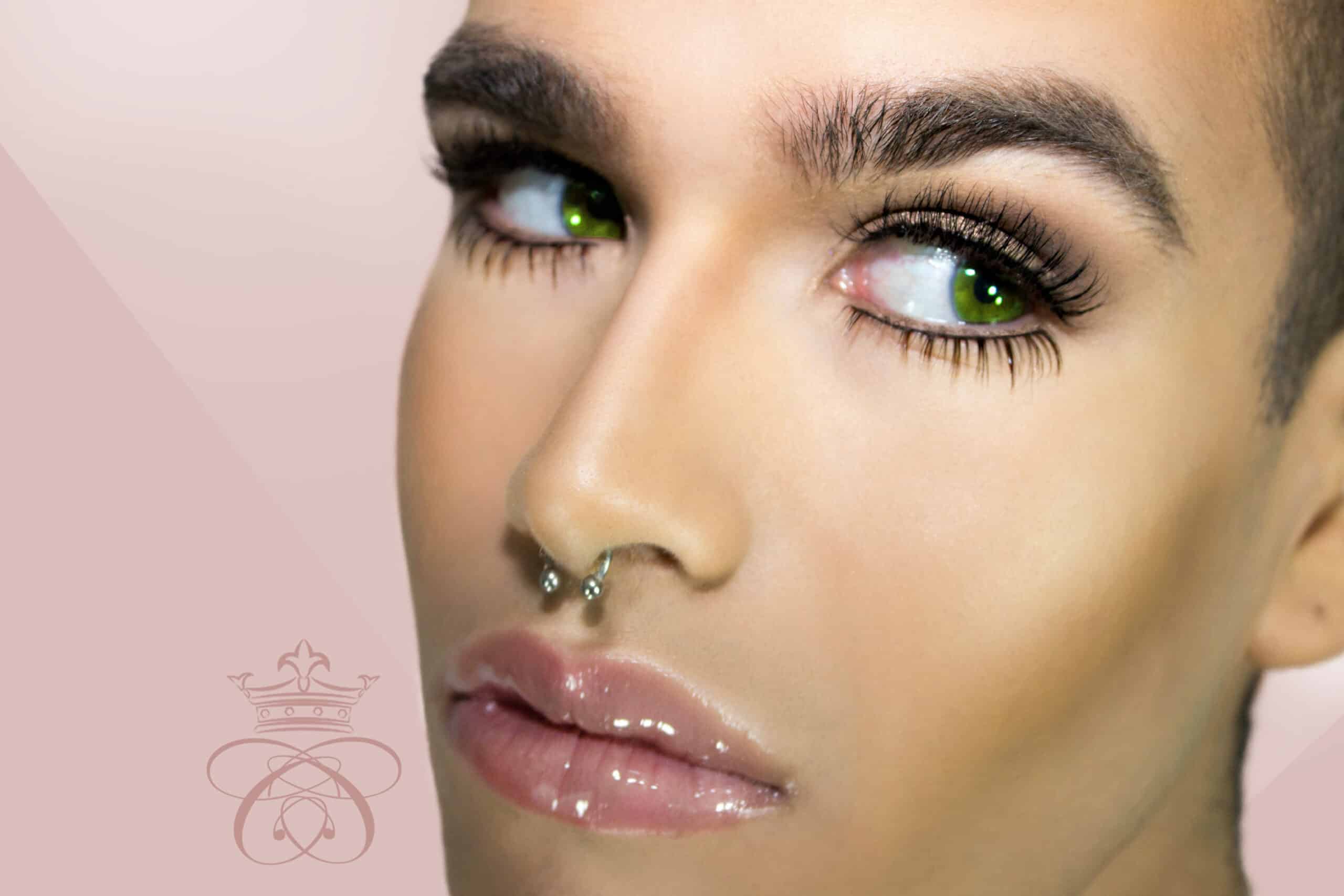 Faux Naturale Strip Eyelash Collection, male model wearing strip eyelashes on light pink background