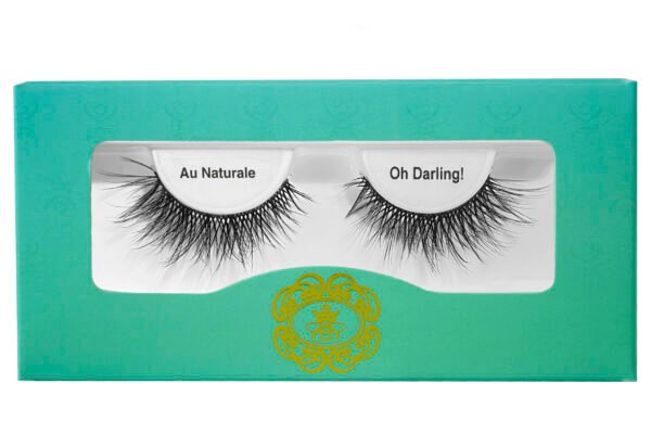 black strip eyelashes in gradient blue-green eyelash box on white isolated background.