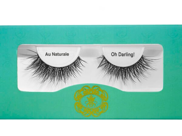 black strip eyelashes in gradient blue-green eyelash box on white isolated background.