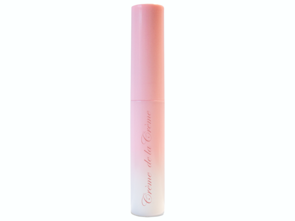 latex free false eyelash glue in gradient pink to white plastic bottle with wand applicator on white isolated background