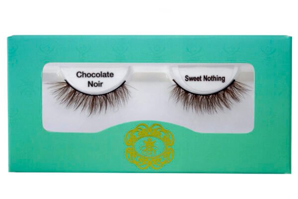 Brown coloured false eyelashes, brown eyelashes in white lash tray inside teal box on white background