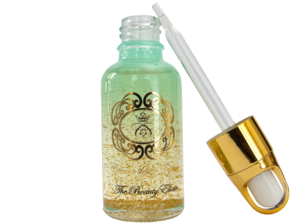 The Beauty Elixir Gold Bar luxury cold-pressed face oil in a blue glass bottle with dropper on a white background