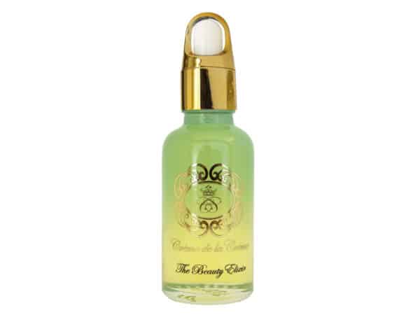 The Beauty Elixir Yuzu brightening face oil in blue glass dropper bottle on white background