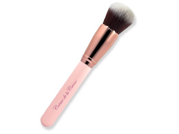 round top, makeup brush, with black and white bristles, makeup brush with pink handle and rose gold ferrule on white isolated background