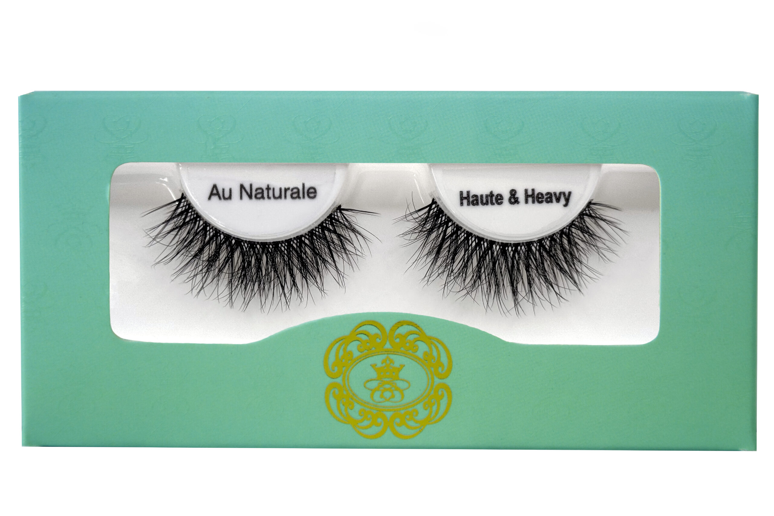 Haute & Heavy Biodegradable Eyelashes black strip eyelashes in gradient blue-green eyelash box on white isolated background.