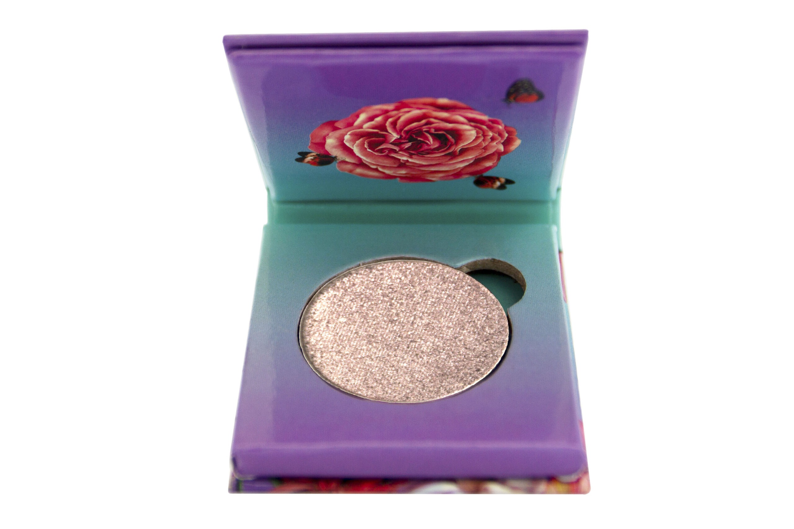Flamingo Paradise Palette Foiled Eyeshadow sitting inside purple and blue 1 pan paper package