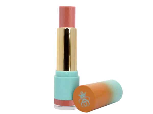Water Balm Lip Serum Collection tinted lip treatment in Ginger Peach shade in gold and blue lipstick case on white background