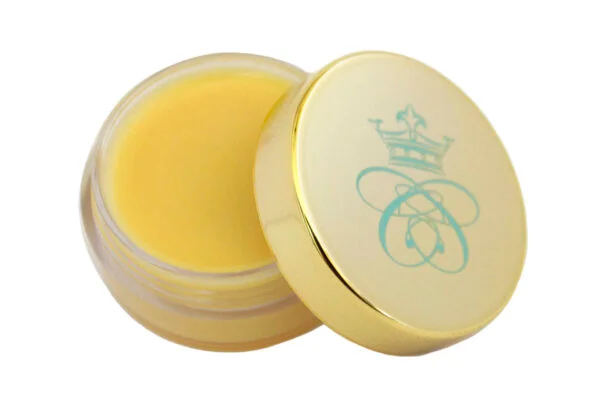 lemon flavoured lip balm in transparent plastic jar with shiny gold lid